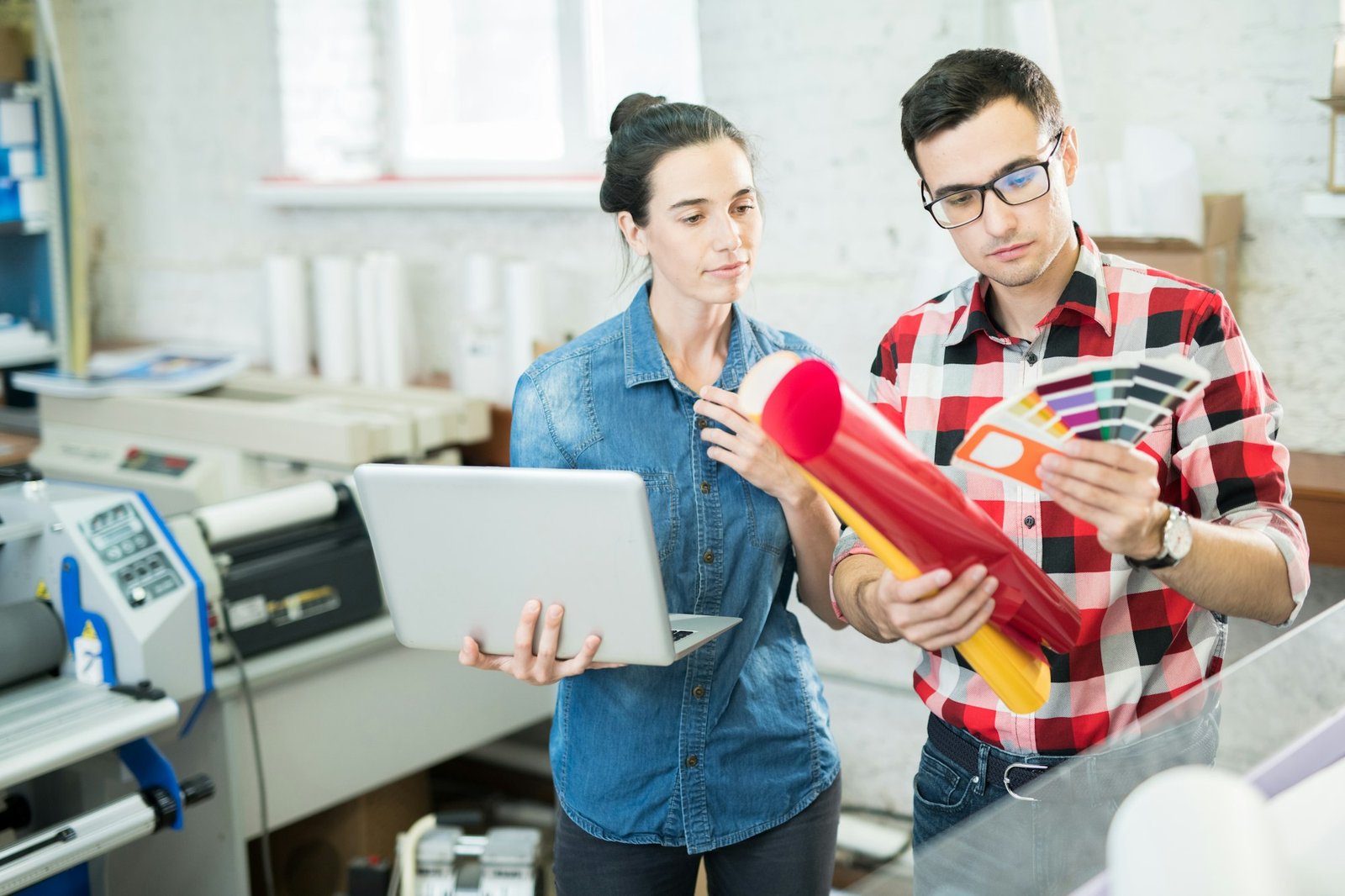 Coworking designers exploring colors with palettes